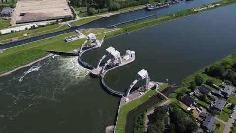High altitude aerial view of modern water channel controller controlled at both sides by a gate or lock these gates commonly control levels and flow rates in rivers and canals 4k drone footage