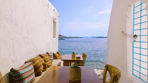 Reserved table in an outdoor romantic restaurant near the Mediterranean Sea in Mykonos, Greece