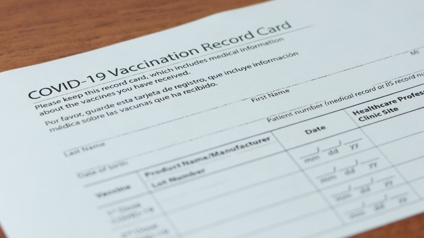 Man fills in the COVID-19 Vaccination Record Card. Royalty-Free Stock Footage #1081755404