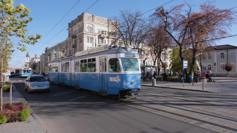 Vinnytsia, Ukraine - October 30, 2021: View of the central street of Vinnitsa, Ukraine and the old bright blue and tram