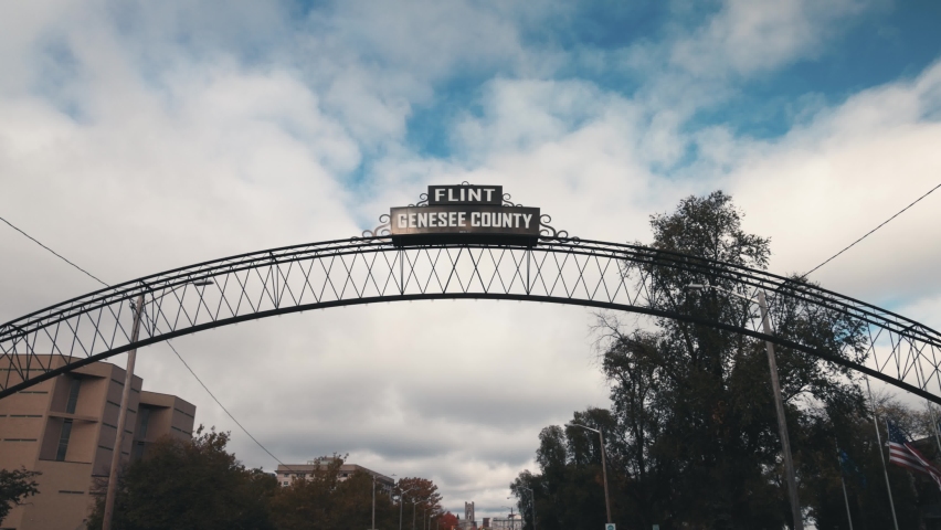 Flint, Michigan city sign with Genesse County. Video shot with gimbal walking towards sign.