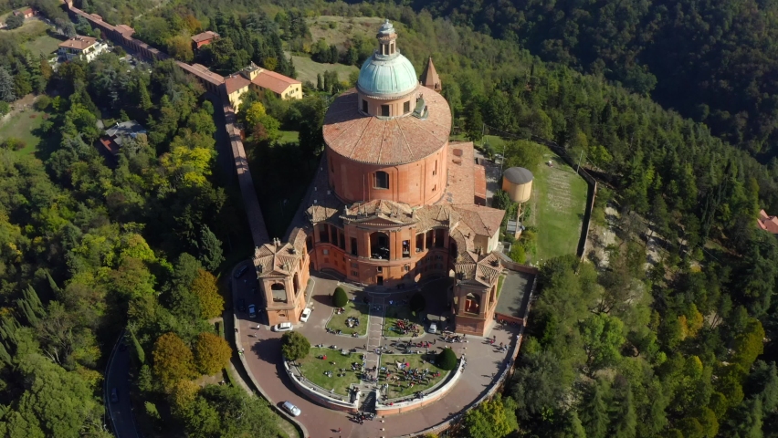 Sanctuary of the Madonna di San Luca, Bologna, Emilia-Romagna, Italy, October 2021. Drone orbits the church at a high angle from the western side while tilted down towards the Basilica. | Shutterstock HD Video #1081760141