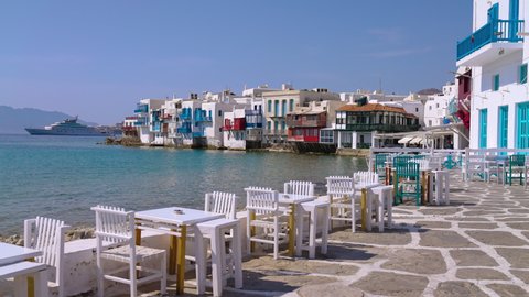 Picturesque Waterfront Restaurant Cafe Tables and Chairs in Little Venice,  Mykonos, Greece