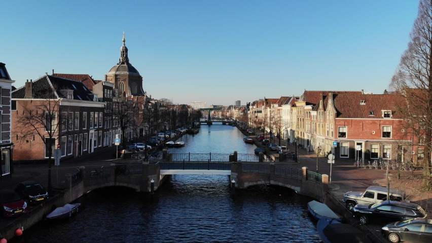 Amsterdam Netherlands aerial view at day. Old dancing houses, river Amstel, canals with bridges, old european city landscape from above Royalty-Free Stock Footage #1081778078