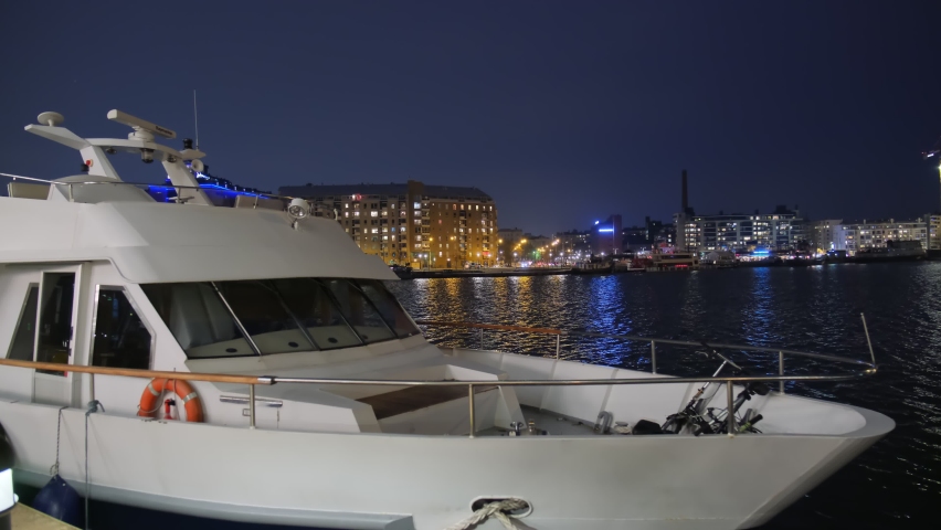 View of the Helsinki at night, the ship is docked on the embankment of Jatkasaari neighborhood, Finland.