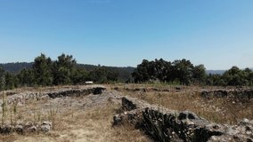 DRONE AERIAL FOOTAGE: The Padrao Mountain Roman Settlement, or Chester, also called Castro of Monte Padrao, built in the 9th century BC and active until the late Middle Ages, in Santo Tirso, Portugal.