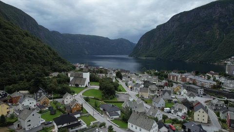 Drone shot over cities in Norwegian fjords