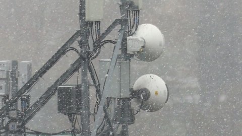 Waterloo, Ontario, Canada October 2021 Cell antenna tower electronic infrastructure with snow falling