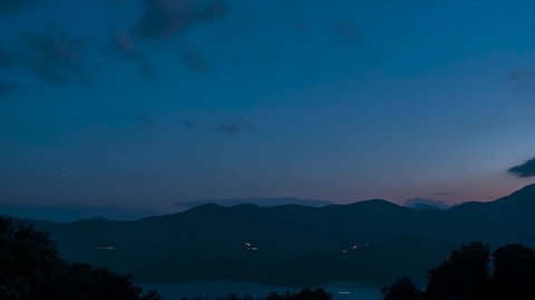 Time-lapse of sunrise over the bay at Porto in Corsica with mountains behind