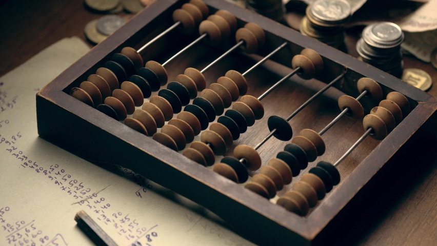 Male hand counting money using old wooden abacus with old paper with mathematical calculations and metal coins on the table close up Royalty-Free Stock Footage #1081802948
