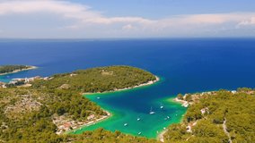 Copter flies over the old town Mali Losinj on the Adriatic coast. Location place Losinj, Kvarner Gulf, Croatia, Europe. Cinematic aerial shot. Discover the beauty of earth. Filmed in 4k, drone video.
