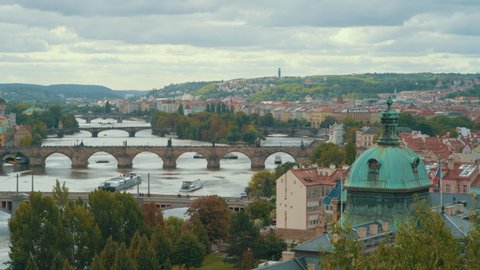 cityscape of Prague, Czech Republic with Vltava view and Charles Bridge on a cloudy autumn day. This video was shot in PRORes 422 codec.