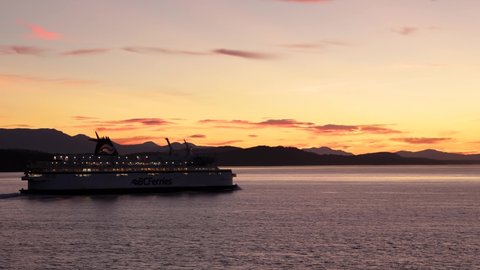 VANCOUVER, BC, CANADA - JUNE 27, 2021: BC Ferry near active pass in the Gulf Islands at sunset. 24FPS 4K