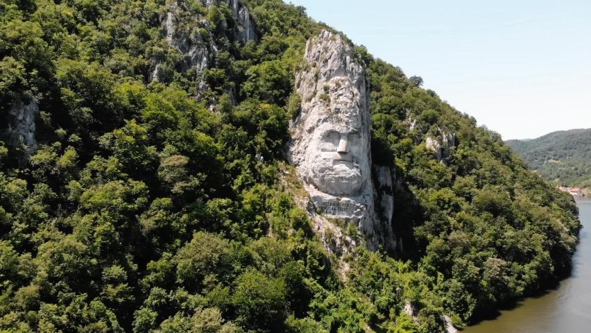 Rock Sculpture of Decebalus, Iron Gates Natural Park, Danube, Romania - aerial pullback