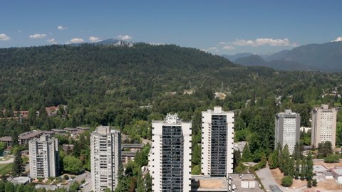 Apartment Complex With Green Forest At Burnaby Mountain In BC, Canada. - aerial