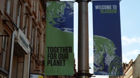 GLASGOW, NOV 2021 - Giant posters in Buchanan Street announcing COP 26 in Glasgow, Scotland, UK, the Conference of the Parties aiming at tackling Climate Change