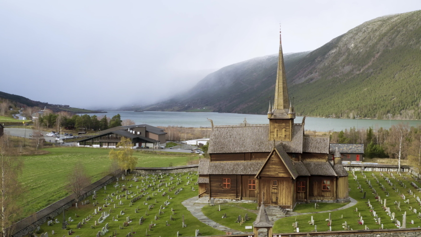 Exterior Of Lom Stave Church In Innlandet County, Norway - aerial drone shot