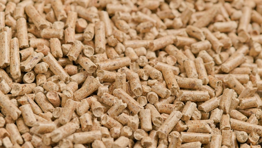 Looped close-up rotation of compacted wooden sawdust pellets - natural cat litter filler or organic fuel | Shutterstock HD Video #1081834073