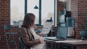 Business woman expecting child and working on project planning with laptop. Pregnant employee designing presentation and marketing strategy, using computer for growth and development. - Powered by Shutterstock - Get 15% off with code: PIKWIZARD15