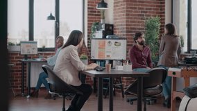 Bored child disturbing business people at work office. Stressed mother working on project, trying to stop daughter interfering with paperwork. Single mom with little girl at workplace. - Powered by Shutterstock - Get 15% off with code: PIKWIZARD15