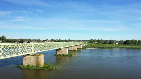 The Loire under the Sully sur Loire bridge in Europe, in France, in the Center region, in the Loiret, in summer, on a sunny day.