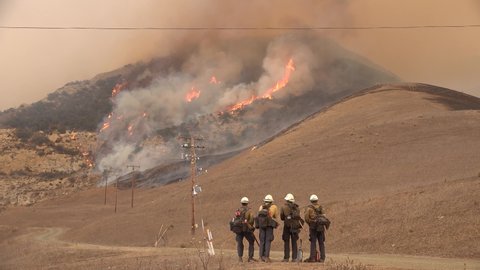 SANTA BARBARA COUNTY, CALIFORNIA - CIRCA 2021- The Alisal fire burns out of control near power lines on a hillside along the Gaviota Coast.