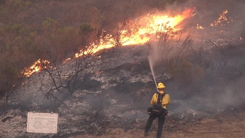 SANTA BARBARA COUNTY, CALIFORNIA - CIRCA 2021- Firefighters attack the Alisal Fire along the Gaviota Coast in Santa Barbara County.