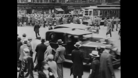 CIRCA 1933 - A traffic cop issues tickets for jaywalkers in an American city (narrated in 1958).