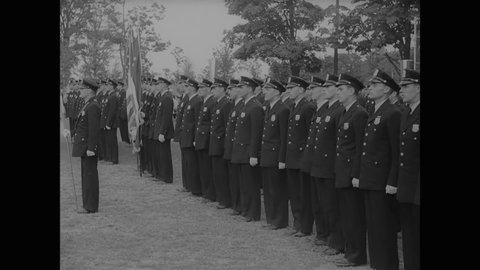 CIRCA 1937 - Graduates march at the New York Police Academy's commencement ceremony.