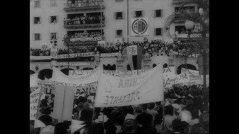 CIRCA 1960 - Huge crowds gather in Caracas, Venezuela to show their support for President Betancourt, after communists made an attempt on his life.