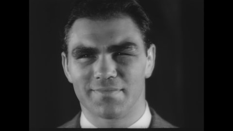 CIRCA 1936 - Max Schmeling smiles at a press conference before a fight with Joe Louis (narrated in 1961).