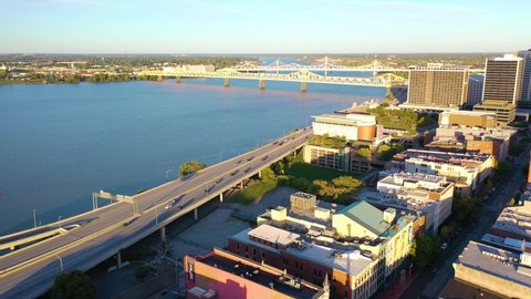 LOUISVILLE, KENTUCKY. - CIRCA 2020s - Aerial establishing shot of the downtown business district and Ohio River in Louisville, Kentucky.