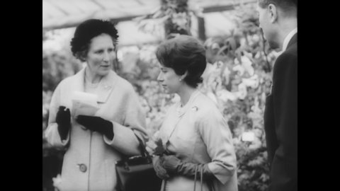 CIRCA 1961 - Queen Elizabeth II opens the Chelsea Flower Show, with the Queen Mother, Princess Margaret, and Prince Philip in attendance.