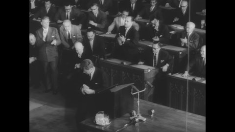 CIRCA 1961 - Jackie Kennedy watches JFK give a speech to Canada's Parliament, urging unity between their countries.
