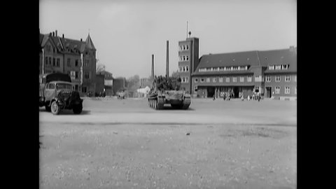 CIRCA 1945 - German soldiers leave their vehicles upon surrendering in Iserlohn, Germany.
