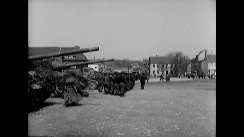 CIRCA 1945 - German soldiers line up in the square of Iserlohn to surrender to the allies.