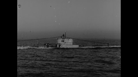 CIRCA 1940s - A US Navy submarine starts to submerge.