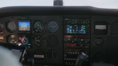 
Small Censsna plane flying at 10,000 feet instrument cluster, instrument gauge while flying. 