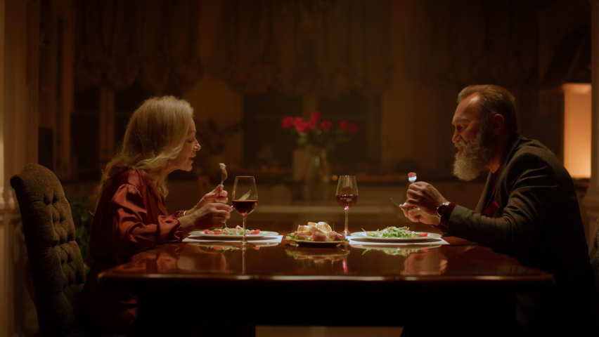 Happy old people retirement. Senior couple eating dinner in evening restaurant. Mature retired family clinking wine glasses romantic dating at home. Elderly wife husband celebrating family anniversary - Powered by Shutterstock - Get 15% off with code: PIKWIZARD15