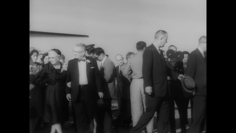 CIRCA 1962 - JFK awards the Distinguished Service Medal to John Glenn at Cape Canaveral.