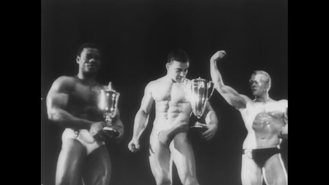 CIRCA 1961 - An overweight man watches the Mr. Europe competition, then heads home and flexes in front of the mirror.