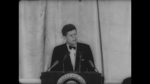 CIRCA 1961 - JFK gives a speech at the Football Hall of Fame Dinner, addressing his time in the armed forces serving under General MacArthur.