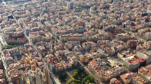 10.04.2019 - Barcelona Spain. City center aerial video footage from above. Eixample square blocks and Sagrada Familia and Avinguda Diagonal