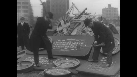 CIRCA 1935 - When gambling is outlawed in New York, roulette wheels and other gambling machinery are chopped up and burned (narrated in 1960).