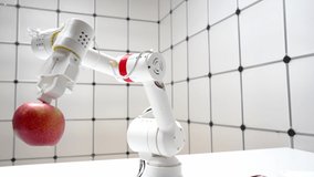 Robot arm with red apple. robot hand is holding a red apple. Modern technology robotics concept. - Powered by Shutterstock - Get 15% off with code: PIKWIZARD15