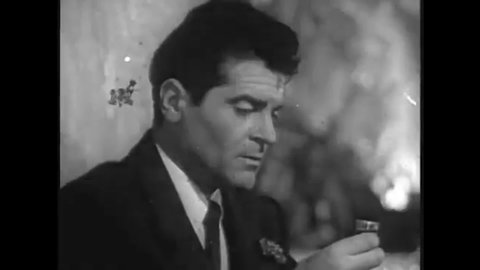 CIRCA 1948 - In this film noir, a woman slaps her blackmailer in a bar.