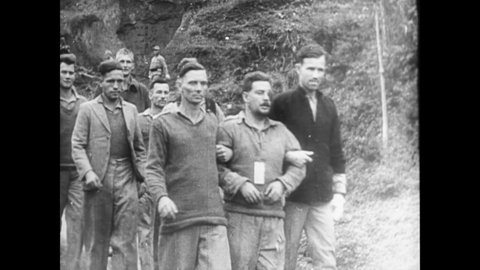 CIRCA 1940s - Japanese soldiers take Americans prisoner.