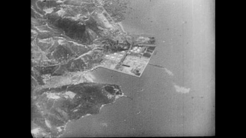 CIRCA 1940s - Japanese fliers bomb allied strongholds off the coast in the Pacific.