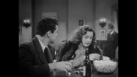 CIRCA 1945 - In this drama film, a woman argues with her alcoholic husband at a bar.
