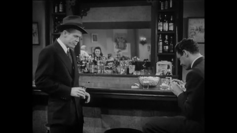 CIRCA 1945 - In this drama film, a drunk man at a bar explains to his friend that he drinks because of his wife.